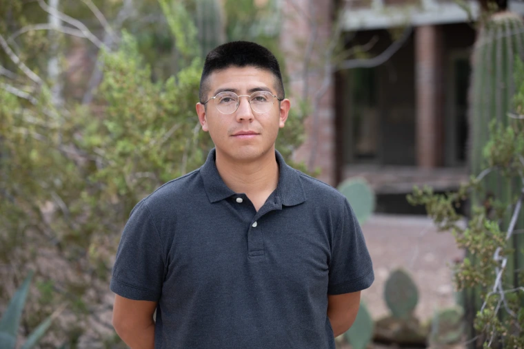 Headshot of Jonathan Espinosa in front of Old Main